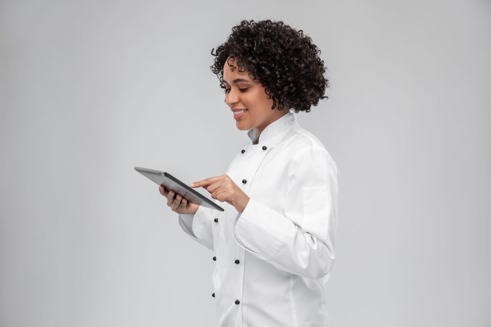 Female chef using a tablet